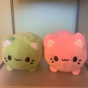 pair of meowchi plushies